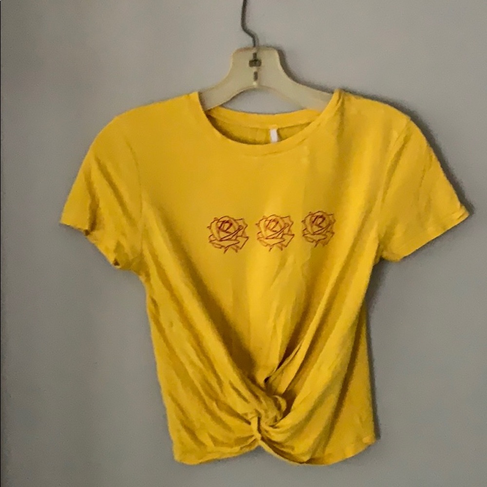 Yellow T-shirt with roses on it